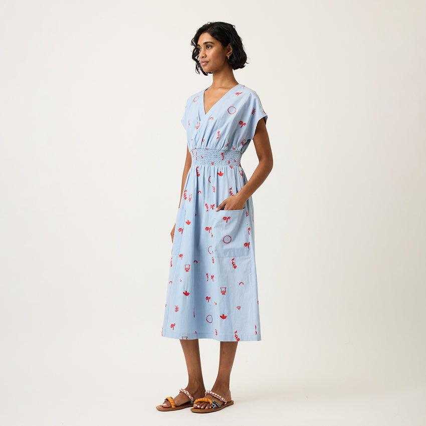 The Nancybird Hana Dress in Motif Embroidery on a model turned to the side