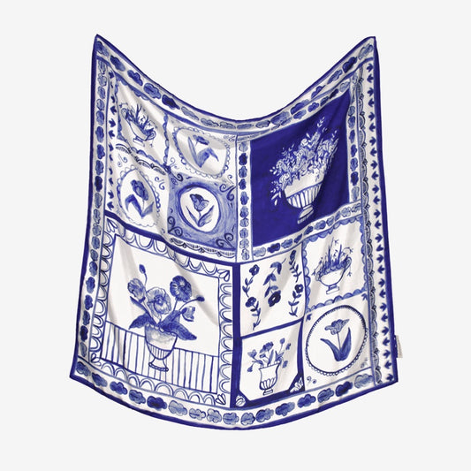 The Nancybird Silk Scarf in Lyon Tile print on a grey background