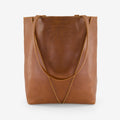 The Nancybird Tri Tote in Tobacco on a grey background