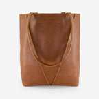 The Nancybird Tri Tote in Tobacco on a grey background