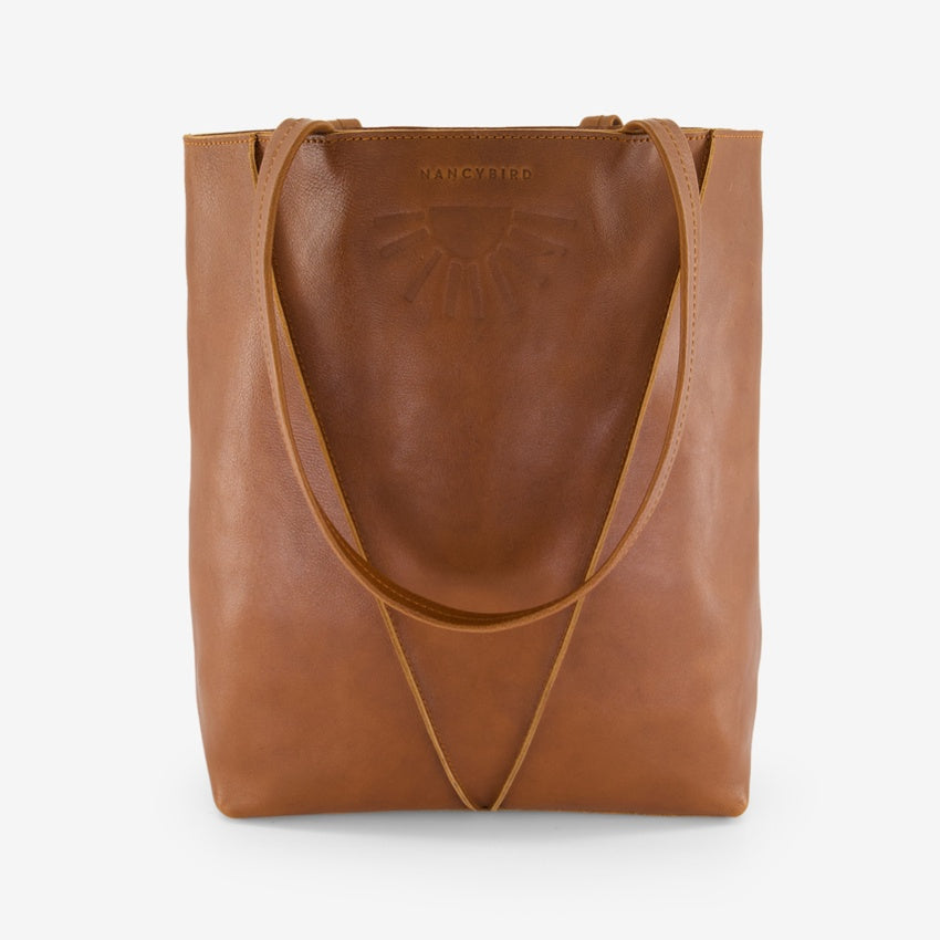 The Nancybird Tri Tote in Tobacco on a grey background