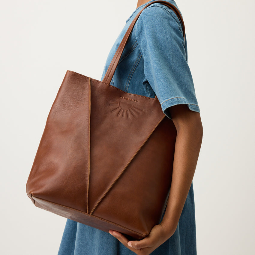The Nancybird Tri Tote in Tobacco on a models shoulder 