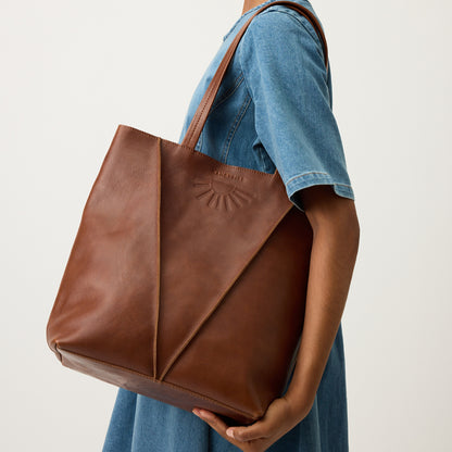 The Nancybird Tri Tote in Tobacco on a models shoulder 