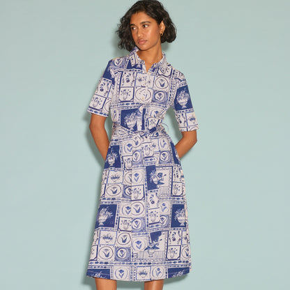 The Nancybird Vera Short Sleeve Dress in Lyon Tile on a model on a blue background
