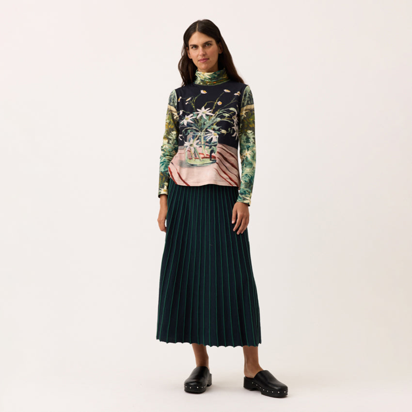 The Nancybird Aine Skirt in Foliage on a model on a blank background