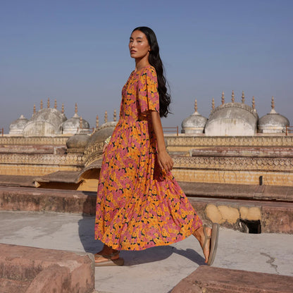 The Nancybird Alba Dress in Sunset Floral on a model in India walking