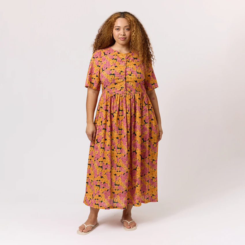 The Nancybird Alba Dress in Sunset Floral on a model on a blank background