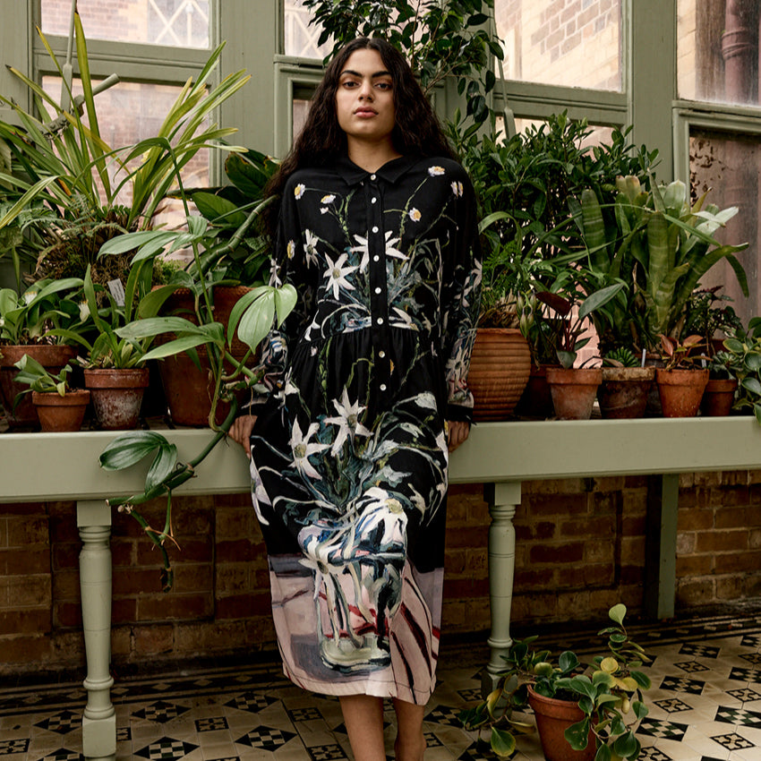 The Nancybird Alla Dress in Still Life on a model infront of plants