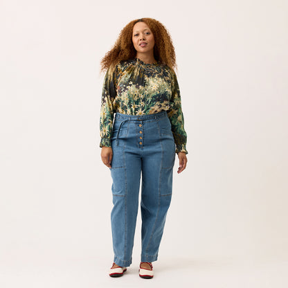 The Nancybird Amos Pant in Denim on a model on a blank background