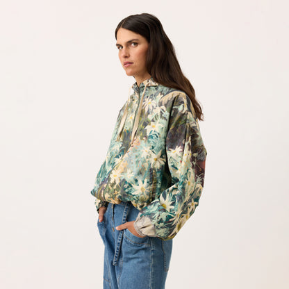 A side view of the Nancybird Bromley Jacket in Flannel Flower on a model on a blank background