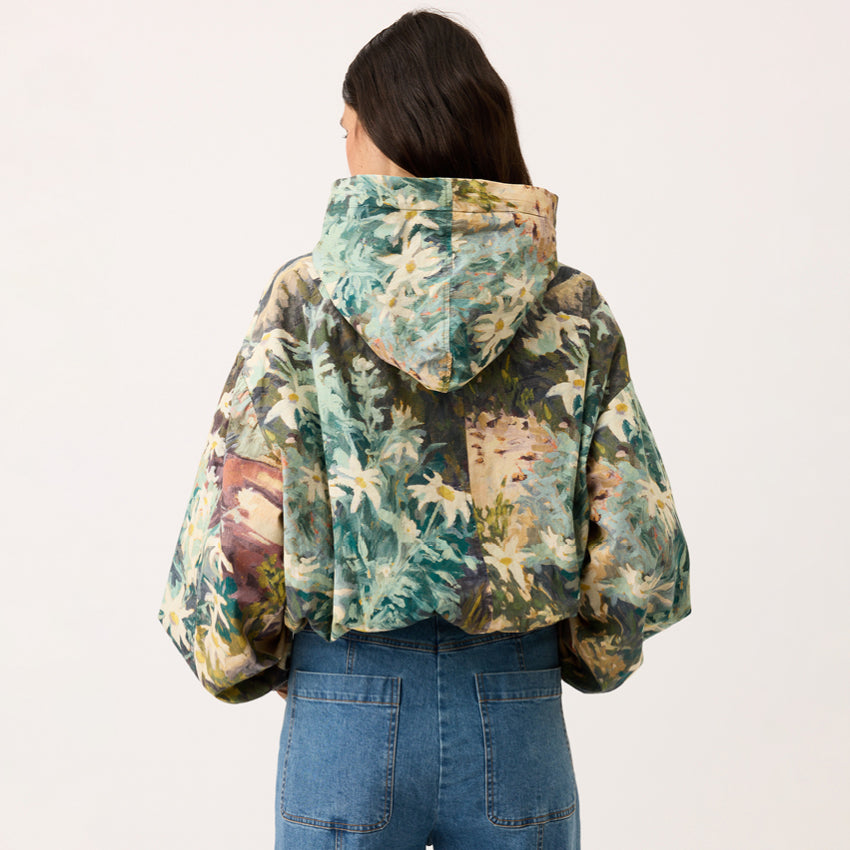 A back view of the Nancybird Bromley Jacket in Flannel Flower on a model on a blank background