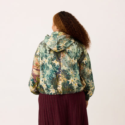 A back view of the Nancybird Bromley Jacket in Flannel Flower on a model on a blank background