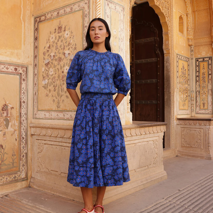 The Nancybird Coco Pintuck Skirt in Midnight Floral on a model with the matching top