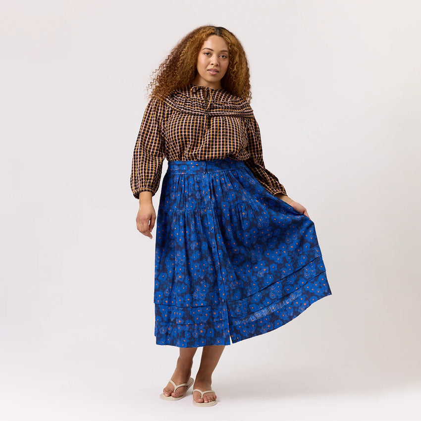 The Nancybird Coco Pintuck Skirt in Midnight Floral on a model on a blank background