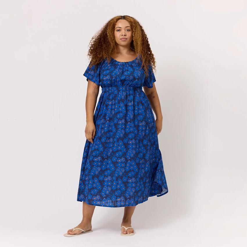 The Nancybird Daphne Dress in Midnight Floral ona model on a blank background