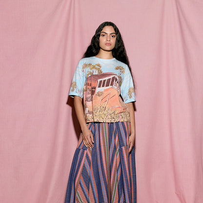 The Nancybird Grace Tee in Shack print on a model on a pink background