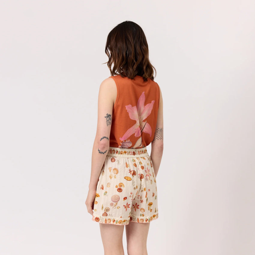 The back of the Nancybird Iris Shorts in Cream Shell on a model on a blank background