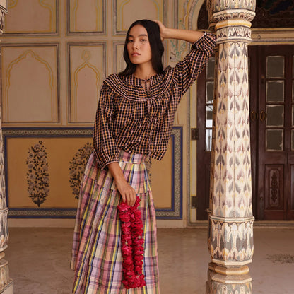 The Nancybird Jira Pintuck Blouse in Jaipur Check on a model paired with a Nancybird skirt