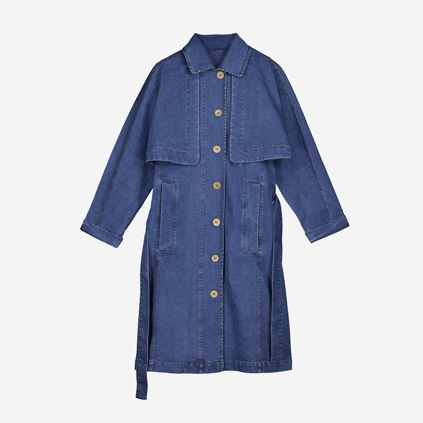 The Nancybird Linu Trench in Denim on a blank background