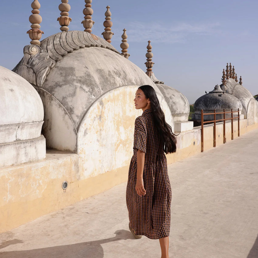 A back view of the Nancybird Luma Shirt Dress in Jaipur Check on a model