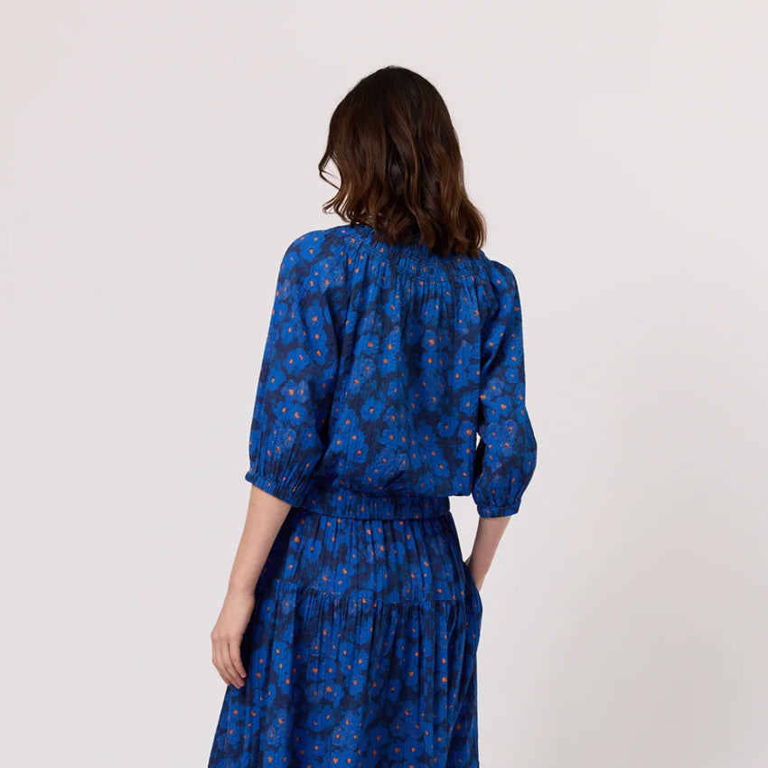 The back of the Nancybird Maha Top in Midnight Floral on a model on a blank background