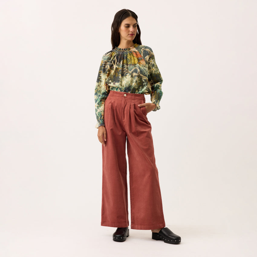 The Nancybird Niko Pants in Spice on a model on a blank background