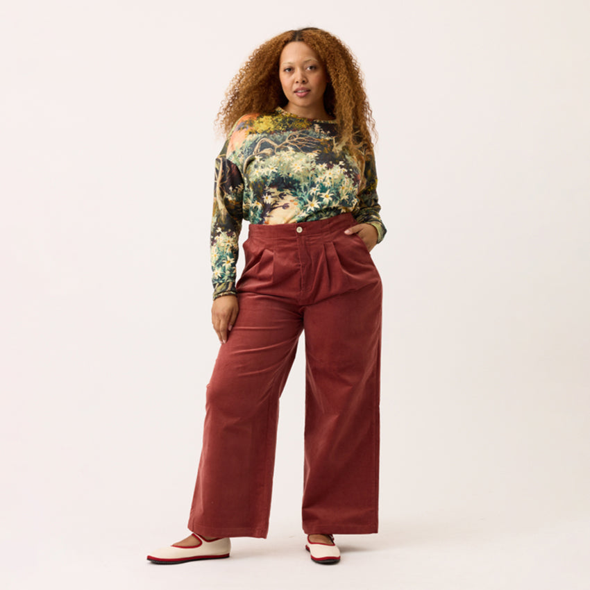 The Nancybird Niko Pants in Spice on a model on a blank background