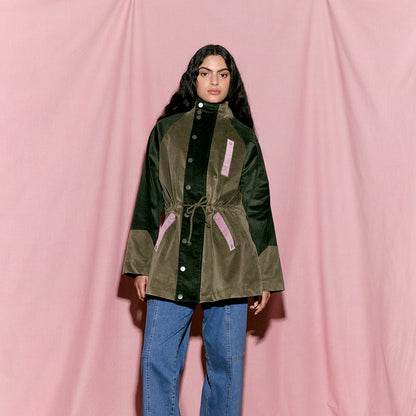 The Nancybird Quinn Anorak in Garden on a model on a pink background