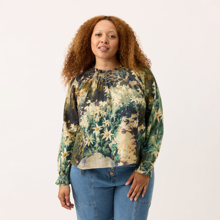 The Nancybird Rowena Shirred Blouse in Flannel Flower on a model on a blank background