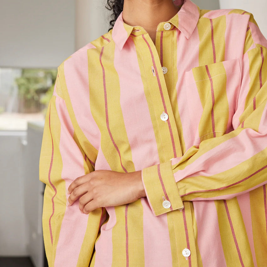 A closeup of the Nancybird Sabine Shirt in Dusk Stripe on a model