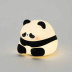 The Ned Collections Sumo Panda Night Light turned on on a blank background