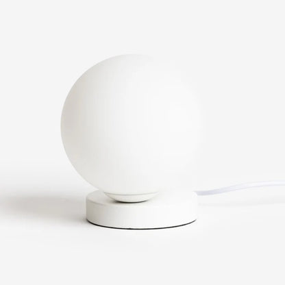 The Ned Collections Yuri Table Lamp turned off on a blank background