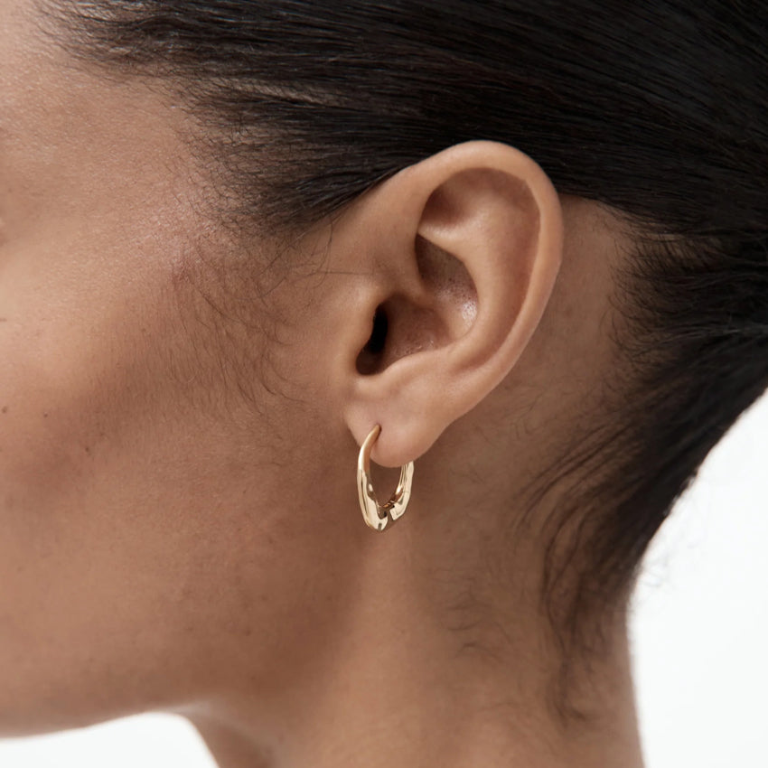 The Nina Gordon Dajia Hoop in Small 14k Vermeil on a model