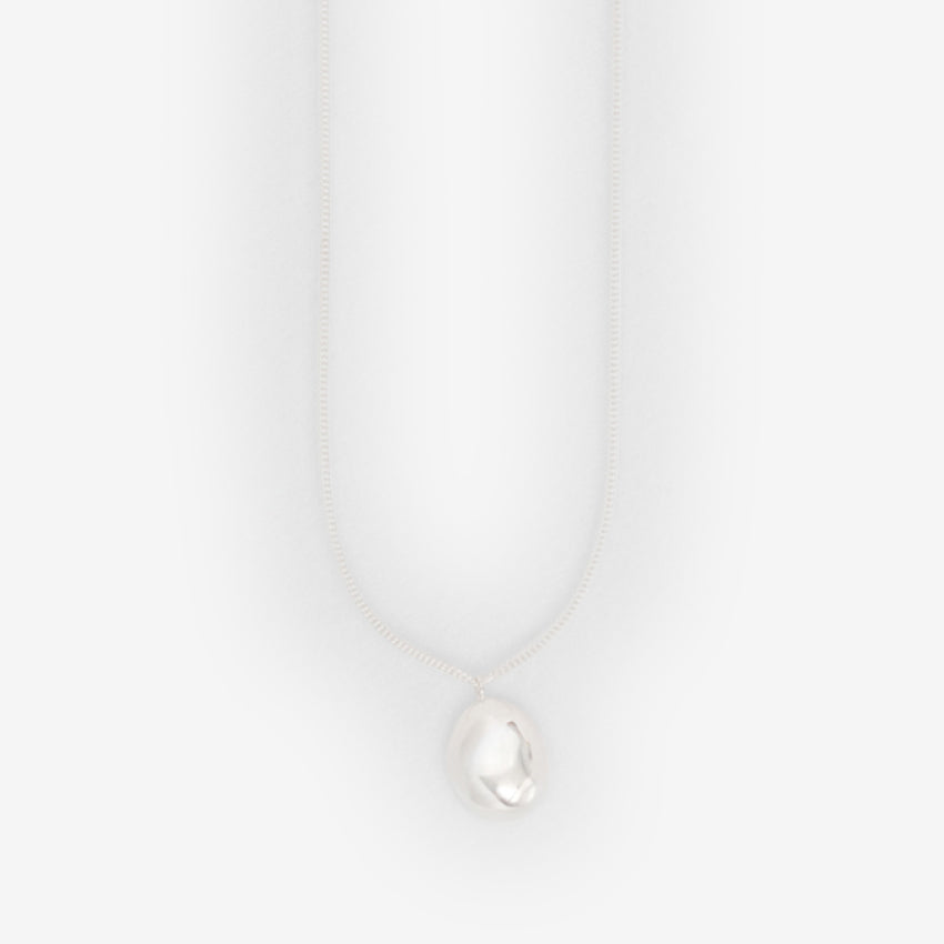 The Nina Gordon Drop Necklace in Sterling Silver on a blank background