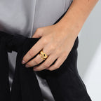 The Nina Gordon Jean Ring Set in Gold on a models finger