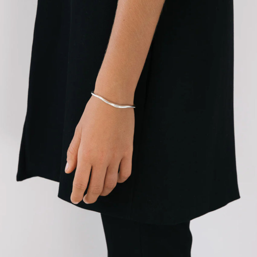 The Nina Gordon Lucid Wrist Cuff in Silver on a model's wrist