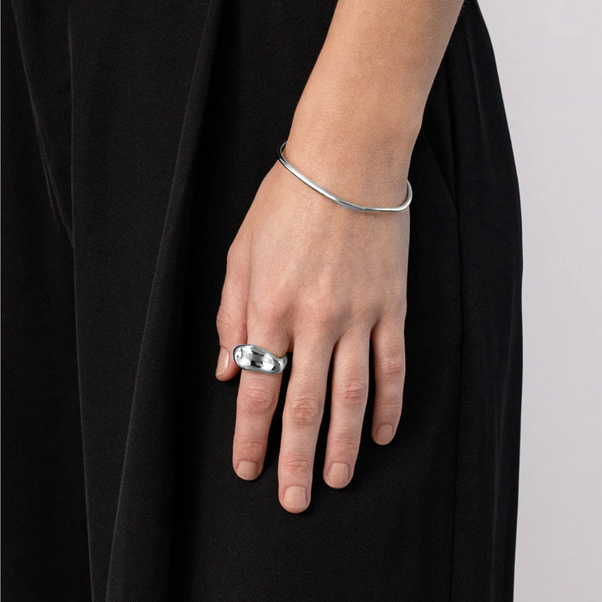 The Nina Gordon Palazzo Ring in Silver on a model's finger