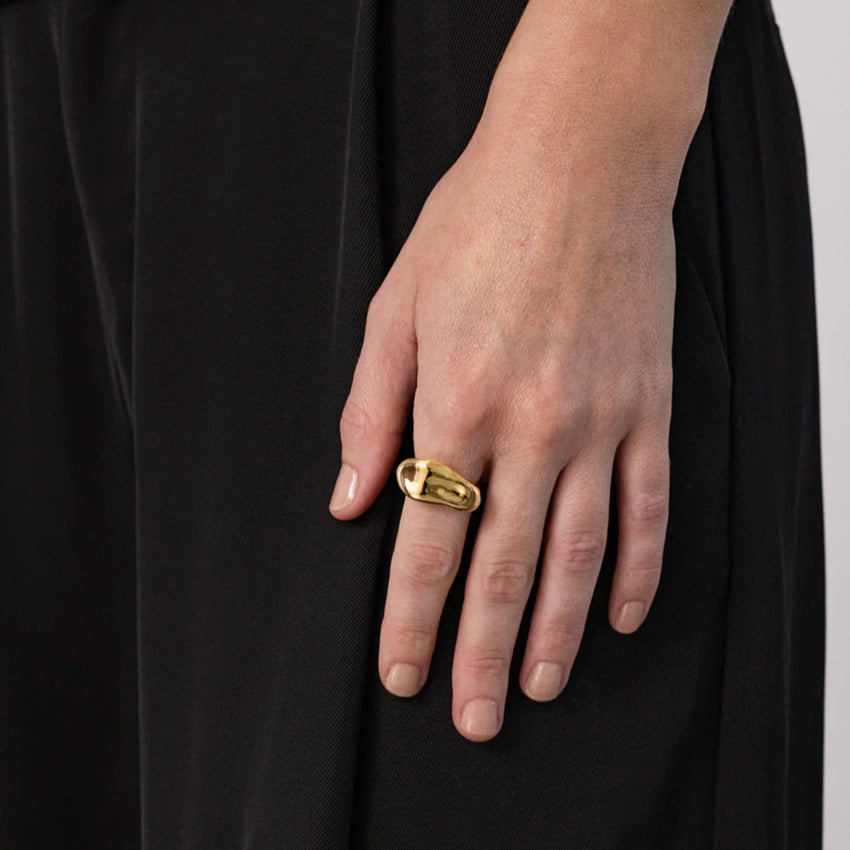 The Nina Gordon Palazzo Ring in Gold on a model's finger