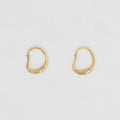The Nina Gordon Ventee Hoops in Gold on a blank background