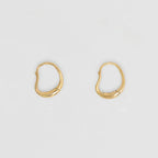 The Nina Gordon Ventee Hoops in Gold on a blank background