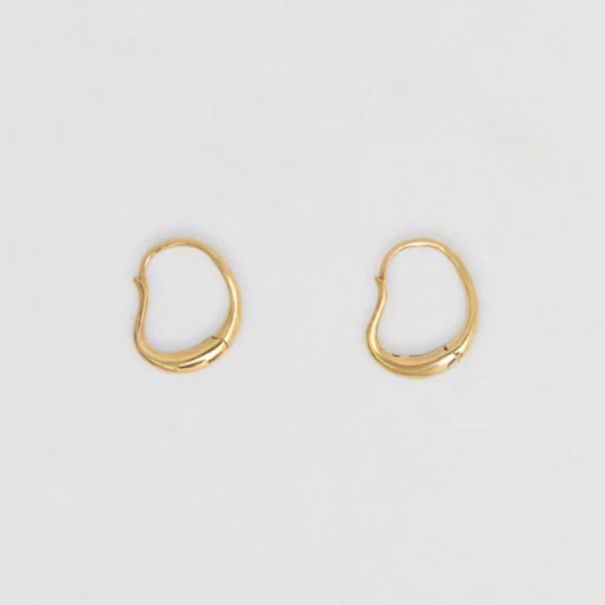 The Nina Gordon Ventee Hoops in Gold on a blank background