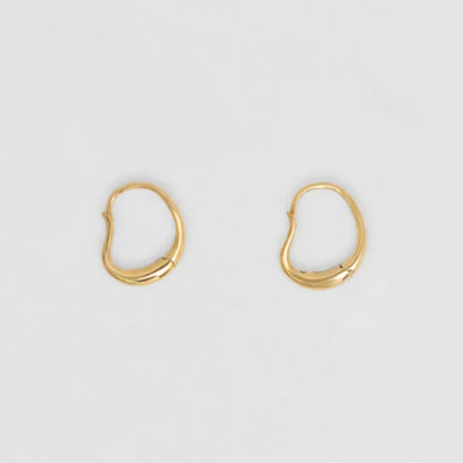 The Nina Gordon Ventee Hoops in Gold on a blank background