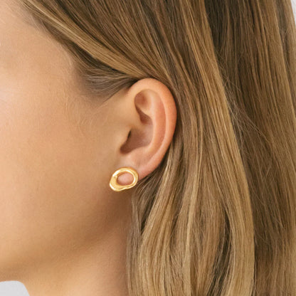 The Nina Gordon Verge Studs in Gold on a model