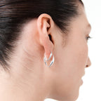 The Nina Gordon Version Hoops in Sterling Silver on a model