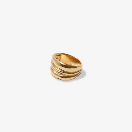 The Nina Gordon Vertigo Ring in Gold on a blank background