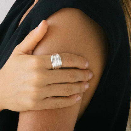 The Nina Gordon Vertigo Ring in Silver on a model's finger