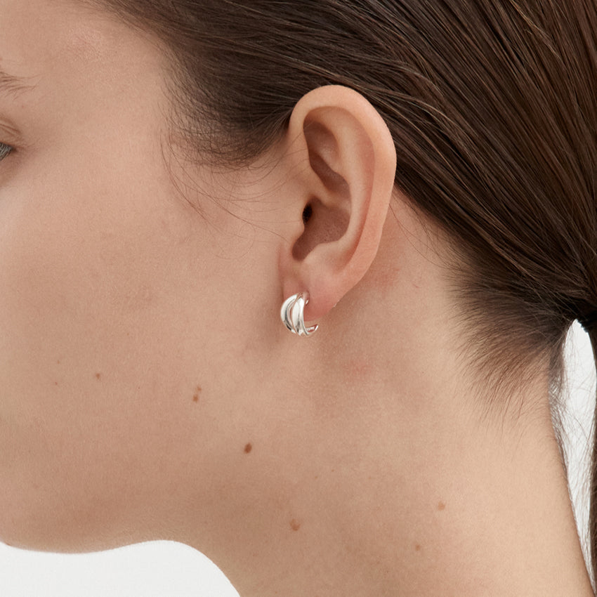 A side view of the Nina Gordon Via Studs in Sterling Silver on a model