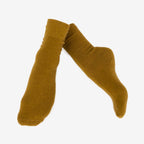 Pair of mustard Nooan Hamilton Possum and Merino Wool socks on a white background