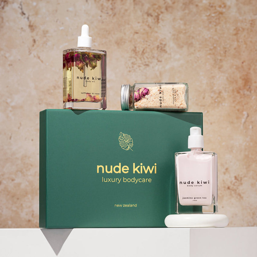 The Nude Kiwi Luxury Bodycare Set with the products sitting on and next to the box