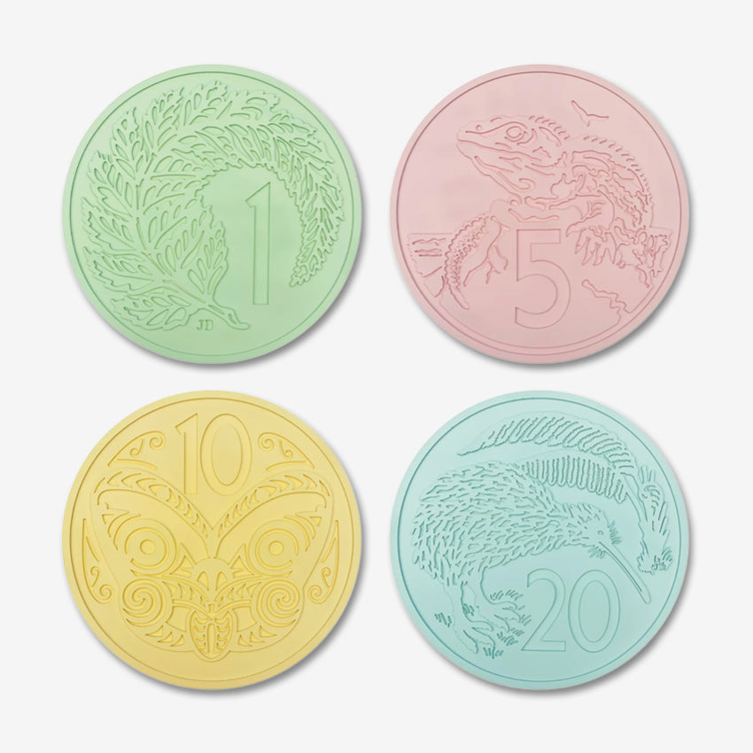 Four of the One Lane Bridge Candy Coins on a blank background